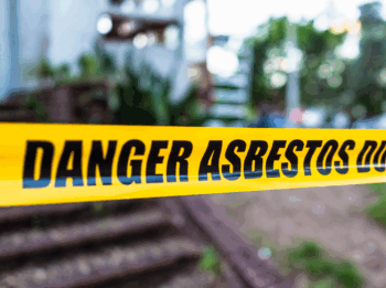 Danger Asbestos tape marking a restricted hazardous materials area, representing Razor Asbestos’ certified asbestos removal services.