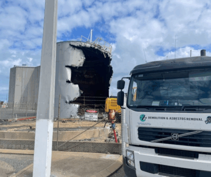Razor Demolition and Asbestos Removal truck on-site during the demolition of 800,000 litre steel tallow tanks at an industrial site in Queensland