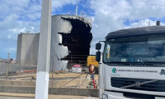 Razor Demolition and Asbestos Removal truck on-site during the demolition of 800,000 litre steel tallow tanks at an industrial site in Queensland