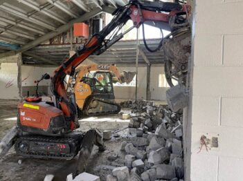 Controlled demolition of internal block walls using compact machinery